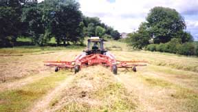 Contractor rowing silage